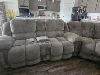 LG.couch with 4 recliners. Electric.  Has charging