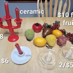 Red ceramic Candelabra, White Ceramic Tapered Candle Holder Plate with Finger Loop Unmarked, 2 glass candleholders, plastic fruit and glass tomato.
Ha