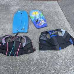 Two Ho Sports Life Jackets And Two Boogie Boards