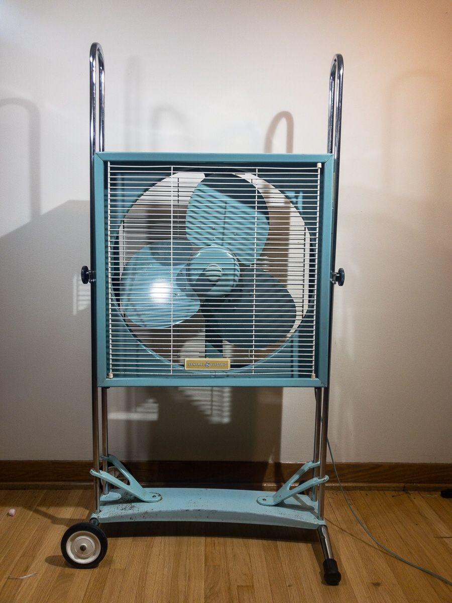 Vintage GE box fan in a Slim line roll about stand by Lakewood