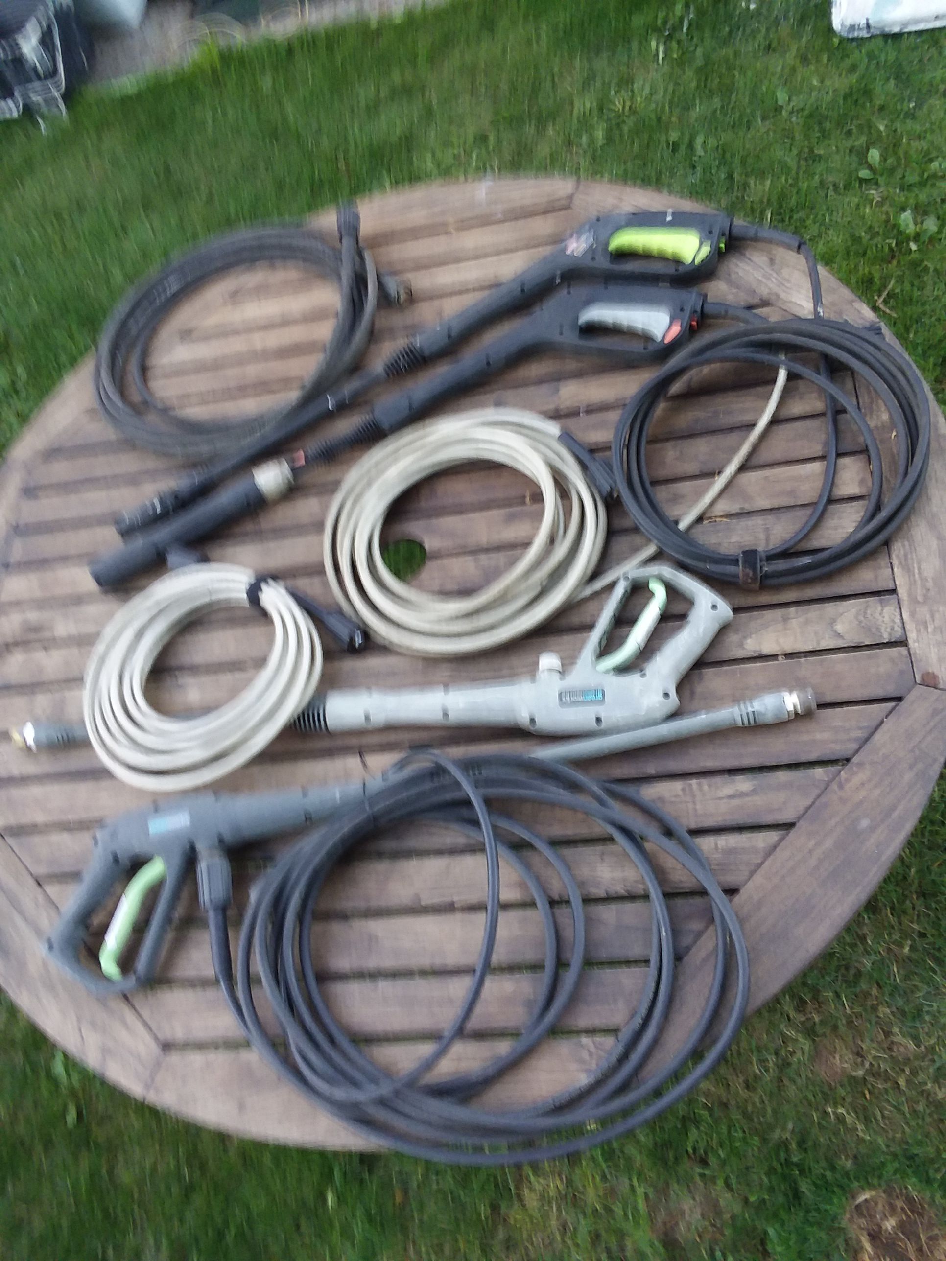 pressure washer wands, greenworks,with attached hoses, and 2 seperate hoses