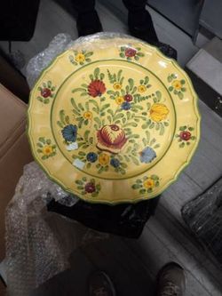 a vintage Italian Majolica Faience plate, likely hand-painted with a floral design in a folk art style