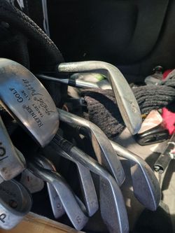 Golfers  + balls + pins