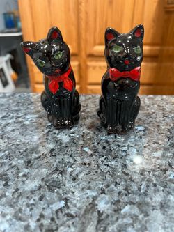 Vintage Shafford Black Cats with Green eyes  pair of Salt and Pepper Shakers.  made in Japan 1950s. Approximately size 4 inches tall.  Preowned good c