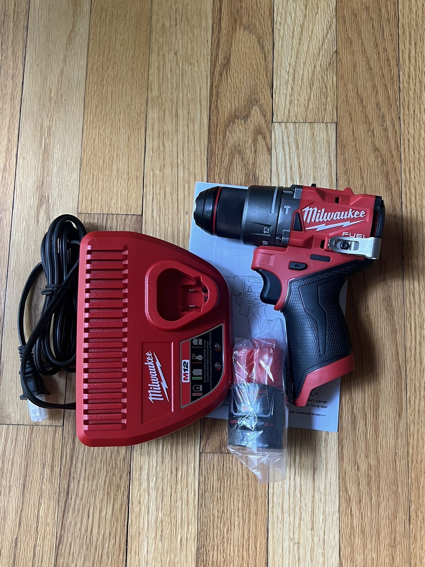 Milwaukee M12 Fuel 1/2” Hammer Drill/ Driver With 2.0ah Battery And Charger ( New)