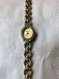 Ladies gold watch with diamond accent. Delicate and pretty. $50.00