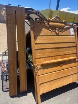 Carved oak headboard and footboard with rails