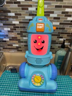 interactive toy Fisher-Price Laugh & Learn Light-Up Learning Vacuum.