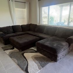 Brown Couched Used Little Rips On The Ottoman 