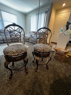 2 heavy swivel bar stools