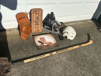 Vintage hockey memorabilia great for the man cave. Includes pads, glove hockey, skates stick puck and helmet. Also includes a nice print picture of th