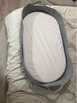 Gray Moses baby changing basket with extra basket