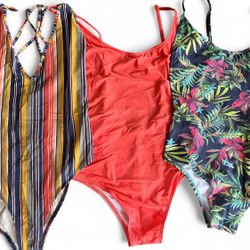 Set of 3 Multi-coloured one-piece swimsuits, each with a unique design #swimwear