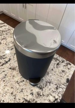 mini trash can. barely used. has sticker on top couldn't get it fully off when i got it. matte black