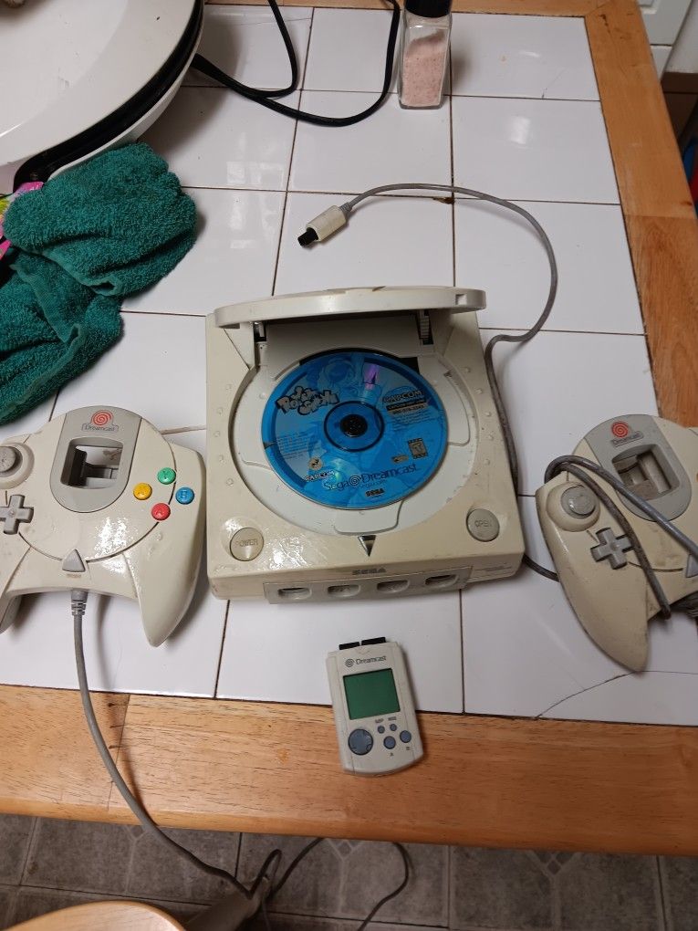 Say a dreamcast with memory card and one game power stone