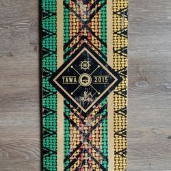 Tawa 2015 skateboard, green, orange, and yellow