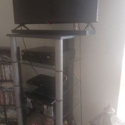 Very Nice TV Stand Or Whatever You Want To Put On It Has Glass I Have My Cable My TV On Top There's Many Things That You Can Put On It If You Like