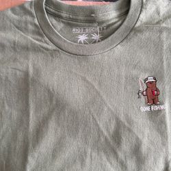 Riot Society Green Gone Fishing Bear With Stick, Reel, and A Fish as Well As A Red Cup and He Has A White Bucket Hat 