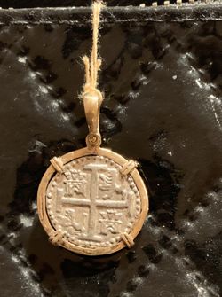 Atocha silver coin pendant in gold bezel