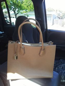 Michael Kors bag size 12inch by 10inch comes with strap