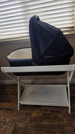 UPPAbaby bassinet with the coordinating white wooden bassinet stand