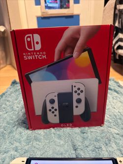 Nintendo switch OLED inbox with all accessories, docking station, charger, HDMI, joycon grip, joycon wrist, straps. No trades cash only no it is not b