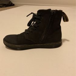 These are Dr.  Martens They are black noir And They Are for a Child the size is a 11