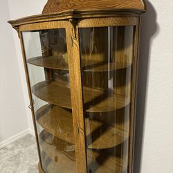 Antique curved glass cabinet