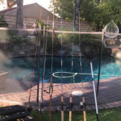 SIX (6) Fishing Rods with Reels PLUS a net & FENWICK Tackle box with Lures.