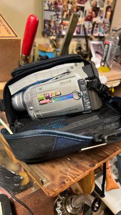 Old school video camera extra bat and cords for charging