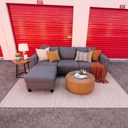 Modern Gray L-Shaped Couch with Storage Ottoman – $280 (Delivery Available)