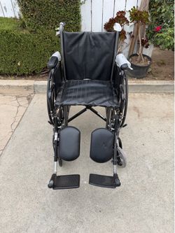 18 inches wide wheelchair in excellent condition with leg elevated  easy to fold by drive