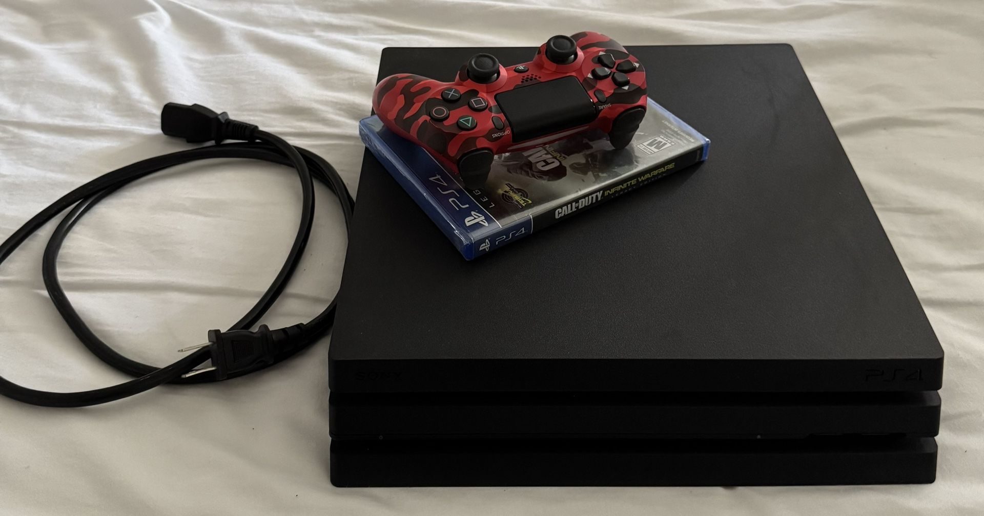 PS4 PRO WITH CONTROLLER AND SEALED COPY OF INFINITE WARFARE