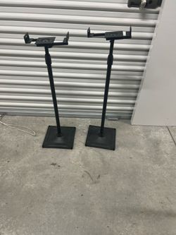 metal universal floor stands for surround sound speakers.