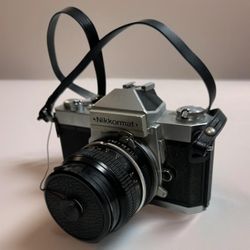 Nikkormat Nikon FT2 SLR Film Camera With Skylight Star D lens 