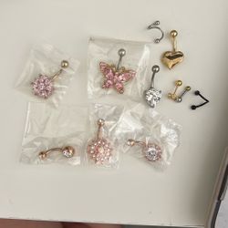 9 Belly button Rings + 2 Ear Piercings