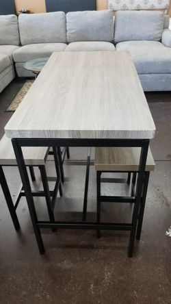 Grey top dinette with 4 stools