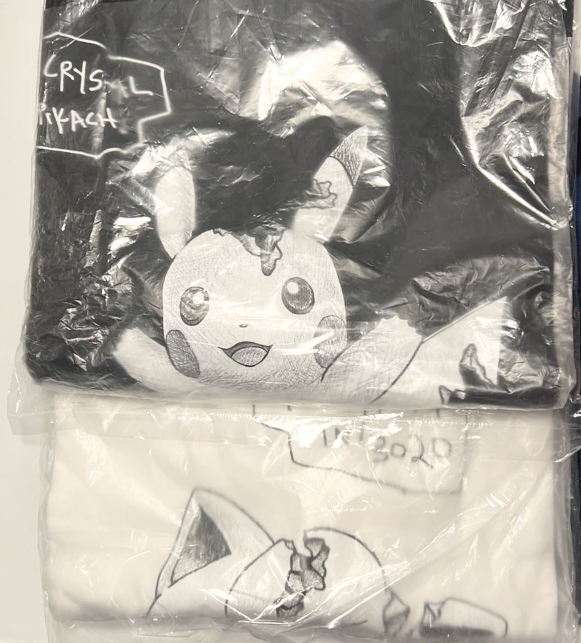 2 x Uniqlo Pokémon X Daniel Arsham Pokémon T- Shirts