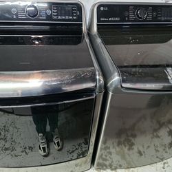 LG 5.7 Cu.Ft. Mega Capacity Top Load Washer With TurboWash And 7.3 cu. ft. Ultra Large Capacity Electric Dryer with EasyLoad Door