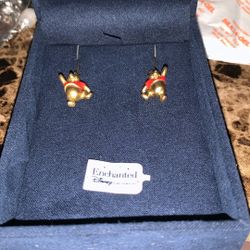 This is a pair of Disney Winnie the Pooh gold-tone enamel drop earrings