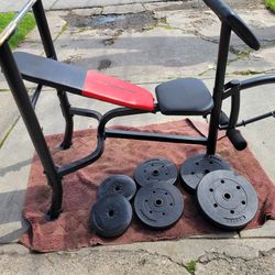 WEIDER WEIGHT BENCH WITH LEG EXTENSION AND PREACHER PAD 1"HOLE  100LBs. PLASTIC WEIGHT 
2-25s  2-15s   2-10s. AND 5' BAR 
7111.S WESTERN WALGREENS 
