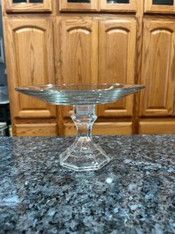 Vintage Glass Round cake plate on a clear pedestal.  Size 7 1/ 2 inches wide and 5 inches tall.  Preowned.
