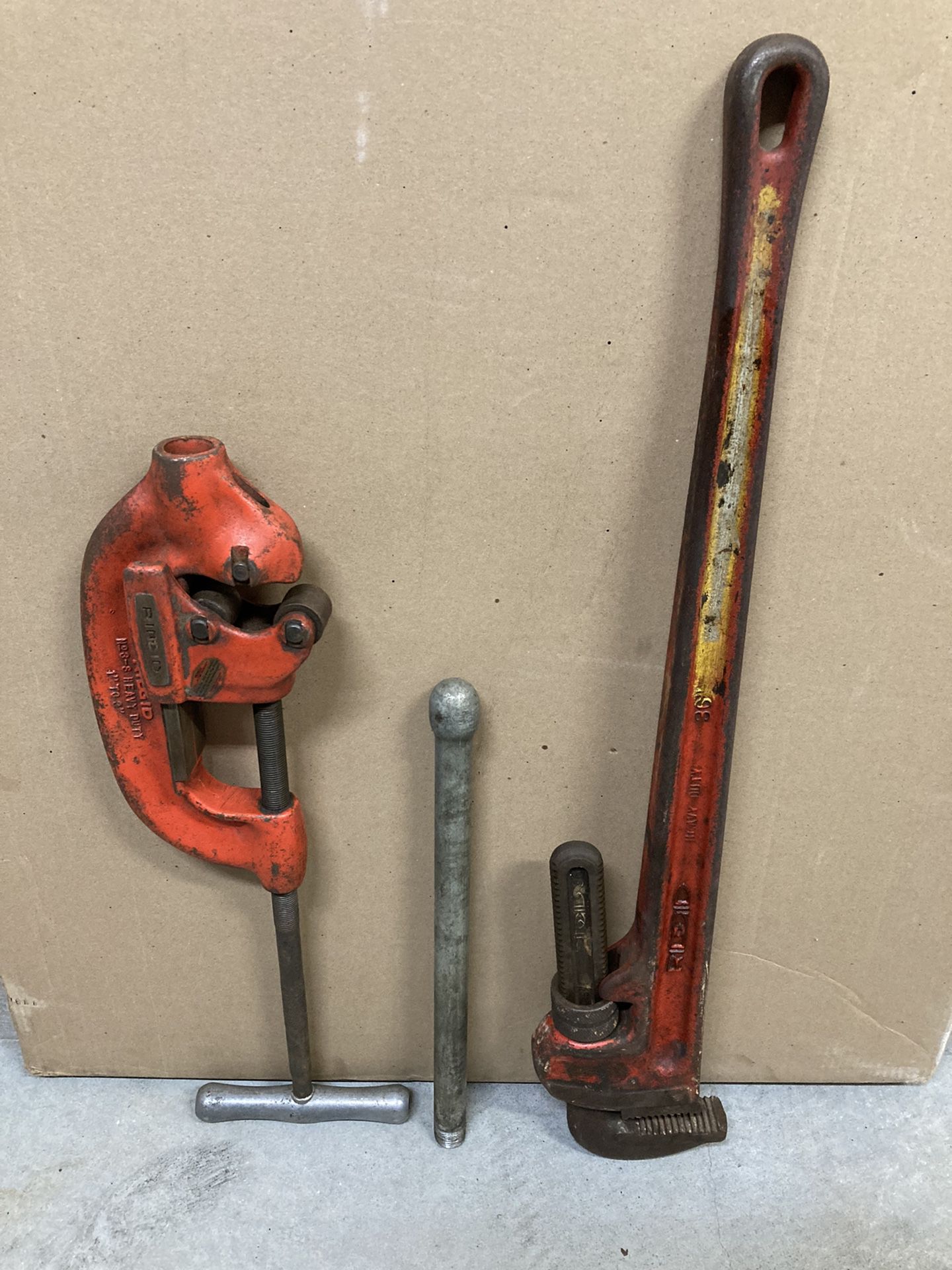 Pipe cutter and pipe wrench