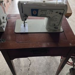 Singer Sewing Machine In Cabinet