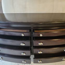 Dark Wood Bow-Front Dresser/ It is an 8-drawer double dresser