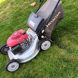 Honda lawn mower In  good condition with blade stop. $350.