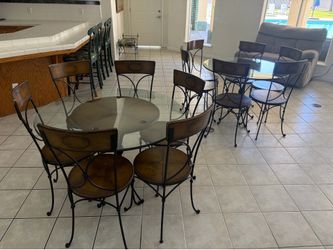 Two Glass Dining Tables and Twelve (12) Chairs