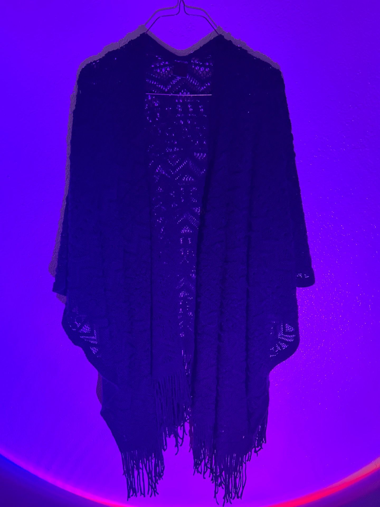 Knitted black shawl with fringe