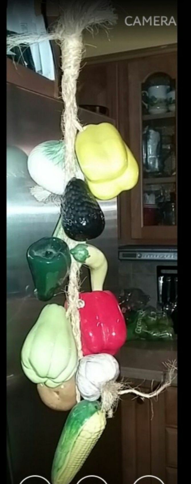 Ceramic veggies on a rope. Great decorative accent for the kitchen. 27" long.