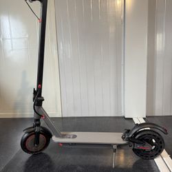 Double shock-absorbing electric scooter
